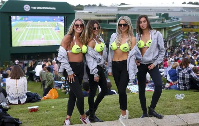 Spectators in Slazenger bikinis look on from Murray Mound during day six of the Wimbledon Lawn Tennis Championships at the All England Lawn Tennis and Croquet Club on July 2, 2016 in London, England. (Photo by Getty Images/Stringer)