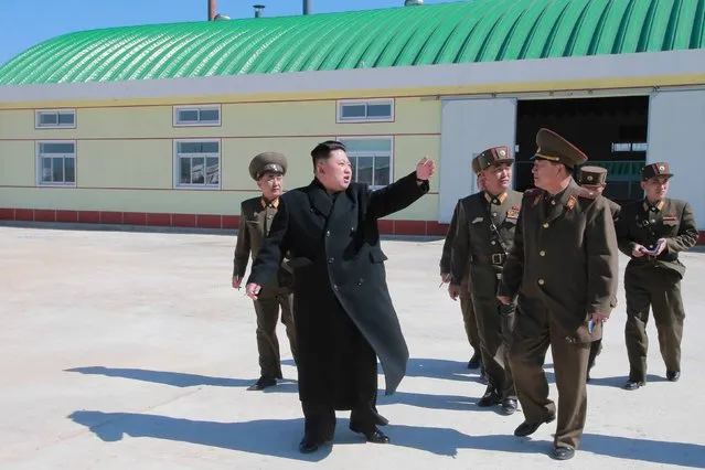 North Korean leader Kim Jong Un gives field guidance at a fish meal fodder factory, newly built by the Korean People's Army (KPA) in this undated photo released by North Korea's Korean Central News Agency (KCNA) in Pyongyang March 24, 2015. (Photo by Reuters/KCNA)