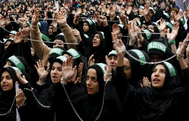 Shi'ite Muslim women shout Islamic slogans as they mourn during an Ashura procession in Istanbul, Turkey, October 23, 2015. Ashura, which falls on the 10th day of the Islamic month of Muharram, commemorates the death of Imam Hussein, grandson of Prophet Mohammad, who was killed in the 7th century battle of Kerbala. Friday marks the day Turkey commemorates Ashura. (Photo by Murad Sezer/Reuters)
