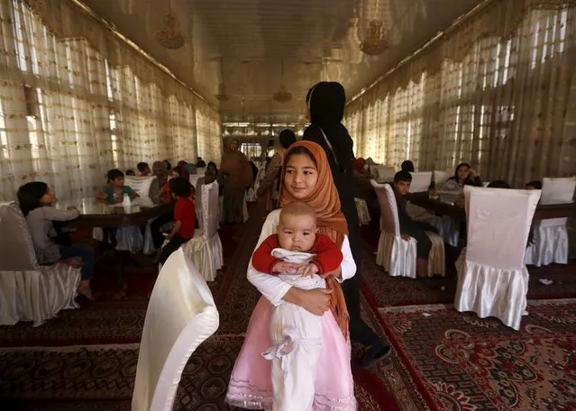 Members of a family who fled Kunduz wait to have lunch at a hotel in Kabul, Afghanistan, October 12, 2015. Thousands of Afghans have fled Kunduz since the Taliban's stunning advance, many of them looking to escape the country altogether and head for Europe. Since Kunduz fell, some 100,000 residents have fled clashes there between Afghan security forces and insurgents, according to U.N. estimates, scattering to camps, hotels and relatives' homes across the north and in Kabul. (Photo by Omar Sobhani/Reuters)