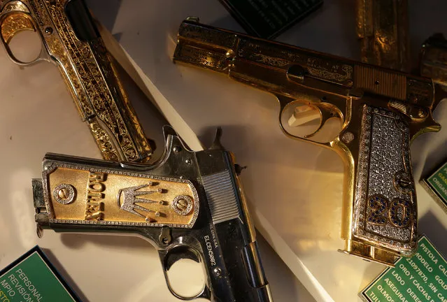 Guns decorated with gold and jewellery are displayed in the Drugs Museum, used by the military to showcase to soldiers the lifestyles of Mexican drug lords, at the headquarters of the Ministry of Defense in Mexico City, October 14, 2016. (Photo by Henry Romero/Reuters)