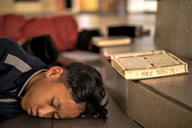 A Student sleep at the Islamic boarding school Hamalatul Quran Al-Falakiyah during the holy month of Ramadan on April 04, 2023 in Bogor, West Java, Indonesia. Students at the Pesantren, also known as “Santri”, are separated from their families and spend their days studying Islamic scriptures, reading the Quran, and learning Arabic in addition to other activities which begin with the morning prayer at 4 am till midnight. (Photo by Garry Lotulung/NurPhoto via Getty Images)