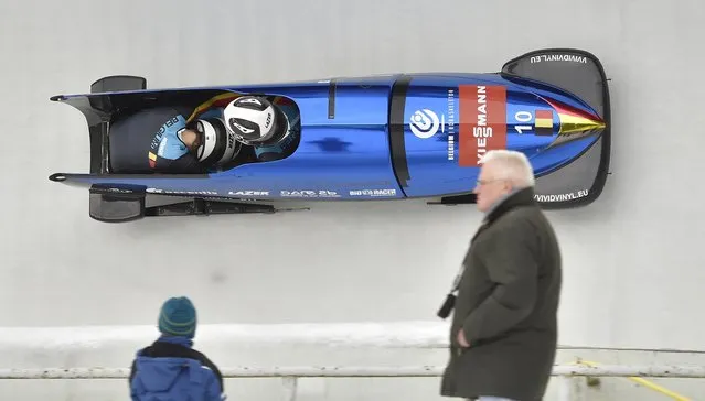 Elfje Willemsen (front) and her pusher Annelies Holthof of Belgium in action during their first run of the Women's Bobsleigh World Cup in Altenberg, Germany, 09 January 2015. (Photo by Matthias Rietschel/EPA)