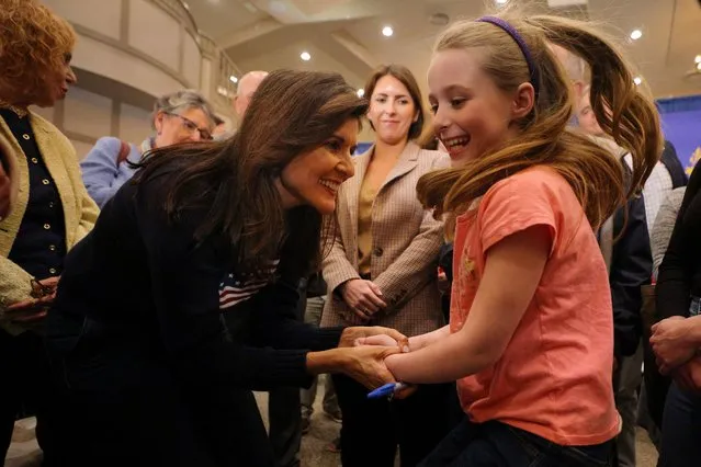Lily Boissonneau, 7, jumps in the air as she talks to Republican presidential candidate and former U.S. Ambassador to the United Nations Nikki Haley at a campaign town hall meeting in Bedford, New Hampshire, U.S., April 26, 2023. (Photo by Brian Snyder/Reuters)