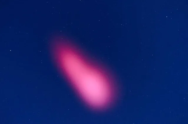 A pink astral cloud appeared in the sky of Tucson, Arizona, after a NASA rocket launch from White Sands, New Mexico, February 25, 2015. The unusual pink cloud was caused by a NASA research rocket launched to study the outer reaches of Earth's atmosphere, scientists said. (Photo by Reuters/White Sands Missile Range)