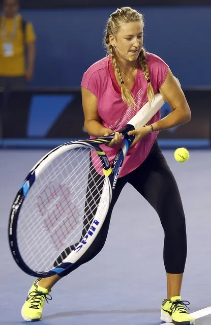 Two-times Australian Open tennis champion Victoria Azarenka of Belarus uses a giant racquet to hit the ball during a charity event on Rod Laver Arena at Melbourne Park January 17, 2015. The Australian Open tennis tournament begins on January 19. (Photo by Issei Kato/Reuters)