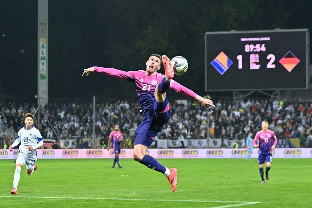 Germany's defender #21 Robin Gosens jumps to control the ball during the UEFA Nations League, League A - Group 3, football match between Bosnia and Herzegovina and Germany at the Bilino Polje Stadium in Zenica, on October 11, 2024. (Photo by Elvis Barukcic/AFP Photo)