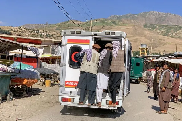 Relatives carry the bodies of slain victims in an ambulance after a bomb explosion during Fatiha prayers at the Nabawi mosque in the Hesa-e-Awal area of Fayzabad district, Badakhshan province on June 8, 2023. At least 11 people were killed by a blast June 8 at a funeral service for an Afghan acting provincial governor whose assassination this week was claimed by Islamic State, the interior ministry said. (Photo by Omer Abrar/AFP Photo)