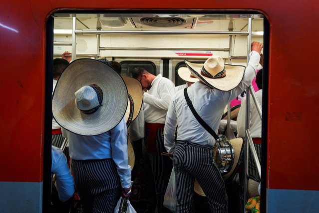 Military personnel wearing traditional costumes travel in the metro to Zocalo Square, to participate in a parade to mark the 114th anniversary of the Mexican Revolution, in Mexico City, Mexico on November 20, 2024. (Photo by Toya Sarno Jordan/Reuters)