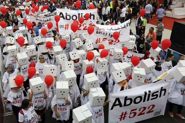 Participants, demanding the abolishment of article 522 of Lebanon's Penal code, take part in the 14th annual Beirut Marathon on November 13, 2016 in the Lebanese capital. Article 522 of Lebanon's Penal Code stops prosecution or execution of any penalty when the perpetrator of a rape, kidnapping, or statutory rape marries the person he has raped or kidnapped. (Photo by Anwar Amro/AFP Photo)