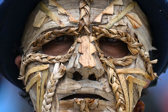 A reveler looks on as he takes part in a parade during the “Blacks and Whites” carnival in Pasto, Colombia on January 4, 2025. The Blacks and Whites carnival has its origins in a mix of Andean, Amazonian and Pacific cultural expressions, and it celebrates the ethnic diversity in the region and was proclaimed by UNESCO as intangible cultural heritage in 2009. (Photo by Raul Arboleda/AFP Photo)