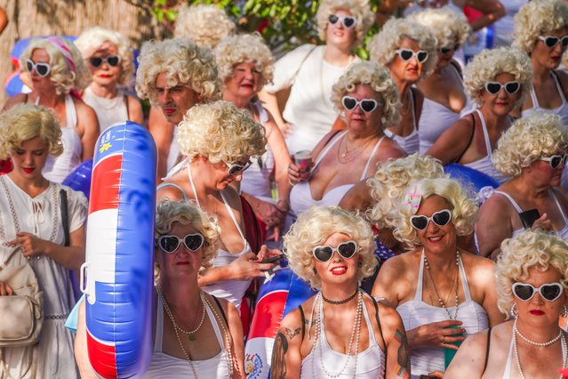 Hundreds of people dressed as Hollywood icon Marilyn Monroe with blond wigs and swimsuits take part in a swim in Adelaide, Australia to raise funds for cancer charities on February 2, 2025. (Photo by Amer Ghazzal/Rex Features/Shutterstock)