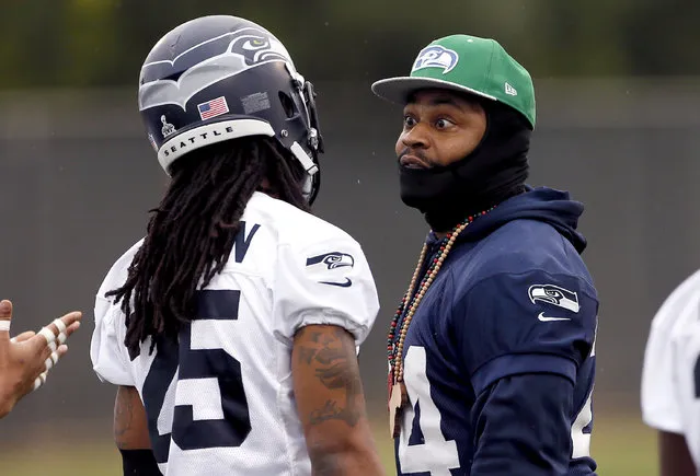 Seattle Seahawks' Marshawn Lynch, right, talks with Richard Sherman during a team practice for NFL Super Bowl XLIX football game, Thursday, January 29, 2015, in Tempe, Ariz. The Seahawks play the New England Patriots in Super Bowl XLIX on Sunday, Feb. 1, 2015. (Photo by Matt York/AP Photo)