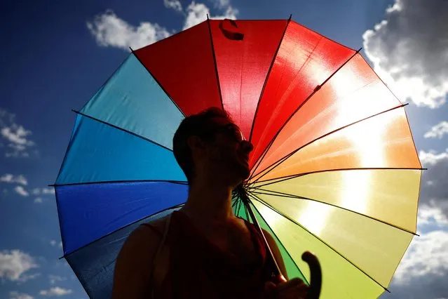 A reveller looks on as he celebrates LGBTQ+ rights during the annual Pride parade in Brasilia, Brazil on July 9, 2023. (Photo by Adriano Machado/Reuters)
