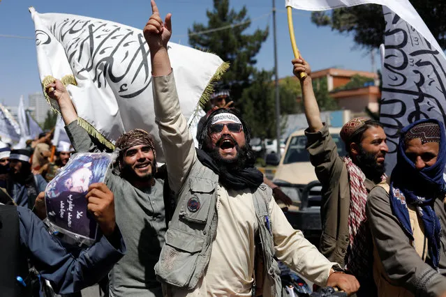 Taliban members rejoice on the second anniversary of the fall of Kabul on a street near the US embassy in Kabul, Afghanistan on August 15, 2023. (Photo by Ali Khara/Reuters)