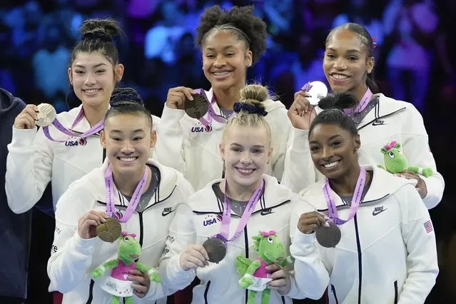 Team USA celebrates with their gold medals after the women's team final at the Artistic Gymnastics World Championships in Antwerp, Belgium, Wednesday, October 4, 2023. (Photo by Virginia Mayo/AP Photo)