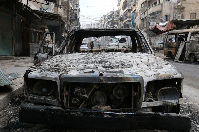 A burnt car is pictured in a rebel-held sector of eastern Aleppo, Syria December 17, 2016. (Photo by Abdalrhman Ismail/Reuters)