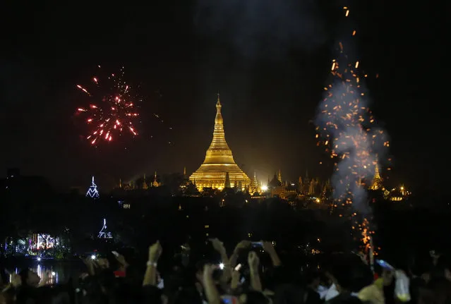 Firework illuminate the night sky over the Myanmar landmark Shwedagon pagoda during the New Year's Eve celebrations at the Kandawgyi Park in Yangon, Myanmar, 01 January 2017. (Photo by Nyein Chan Naing/EPA)