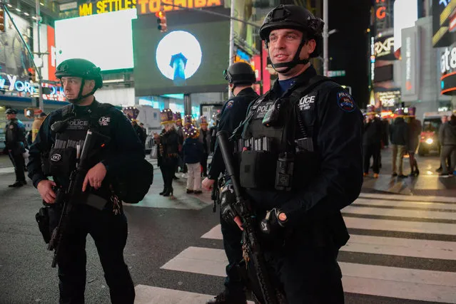 Members of the counter terrorism task force stand guard in Times Square on New Year's Eve in New York, U.S. December 31, 2016. (Photo by Stephanie Keith/Reuters)