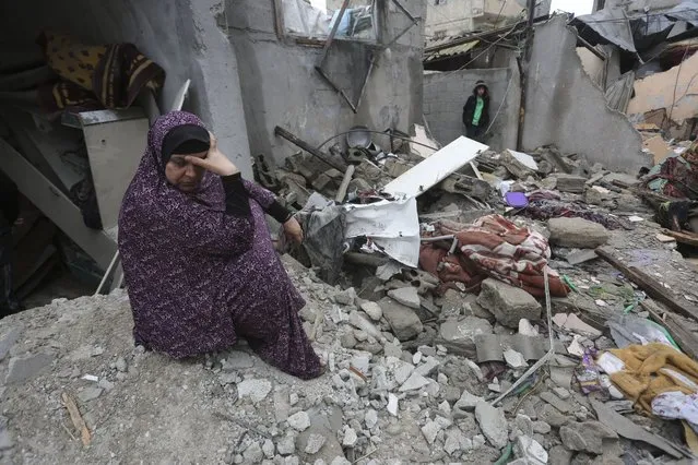 Palestinians look at destruction after Israeli strikes on Rafah, Gaza Strip, Wednesday, November 15, 2023. (Photo by Hatem Ali/AP Photo)