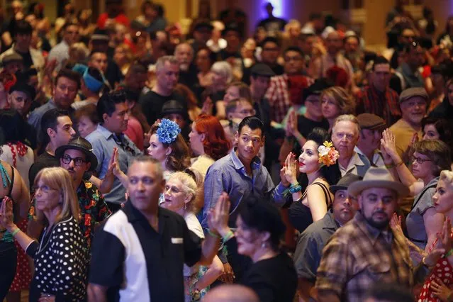 In this April 3, 2015, photo, people crowd the dance floor at a jive dance class during the Viva Las Vegas Rockabilly Weekend in Las Vegas. The event keeps alive dancing and other aspects of the 1950's rockabilly culture. (Photo by John Locher/AP Photo)