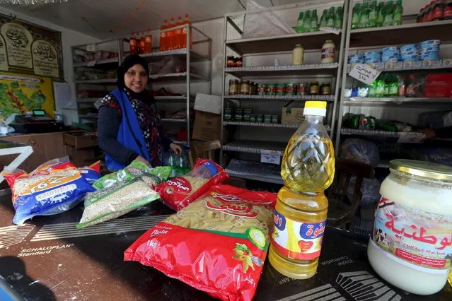 A worker sells subsidized food commodities at a government-run supermarket in Cairo, Egypt, February 14, 2016. Tens of millions of Egyptians rely on state subsidies provided as credits on smartcards they redeem against household staples each month. But in recent weeks, imported commodities like cooking oil have been in short supply as a dollar shortage makes it harder for state importers to secure regular supplies. (Photo by Mohamed Abd El Ghany/Reuters)