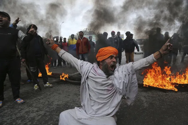 A protestor shouts slogans against Thursday's attack on a paramilitary convoy, in Jammu, India, Friday, February 15, 2019. The death toll from a car bombing on the paramilitary convoy in Indian-controlled Kashmir has climbed at least 40, becoming the single deadliest attack in the divided region's volatile history, security officials said Friday. (Photo by Channi Anand/AP Photo)