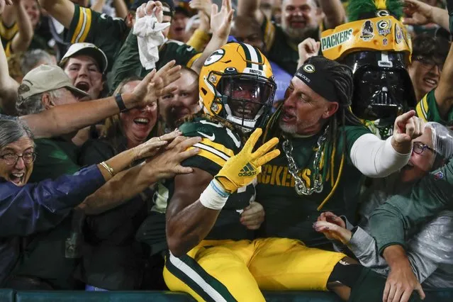 Green Bay Packers' Aaron Jones celebrates his touchdown run during the second half of an NFL football game against the Detroit Lions Monday, September 20, 2021, in Green Bay, Wis. (Photo by Matt Ludtke/AP Photo)