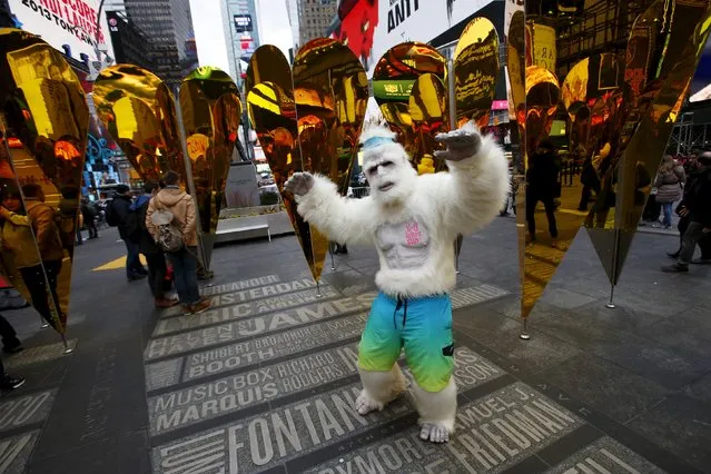 A person dressed as a yeti dances at the “Heart of Hearts” installation by Collective-LOK, which won the annual Times Square Valentine Heart Design competition, in Times Square, New York February 10, 2016. (Photo by Andrew Kelly/Reuters)