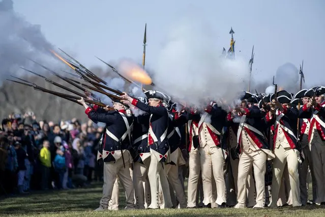Members of Alpha Company, 3d U.S. Infantry Regiment (The Old Guard), give a firing demonstration on the Bowling Green of George Washington's Mount Vernon on Monday, February 19, 2024, in Mount Vernon, Va.  (Photo by Kevin Wolf/AP Photo)