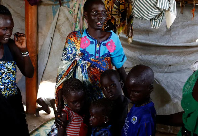 Nyagonga Machul, 38, embraces her children  (L-R) Nyameer Mario, 6, Nyawan Mario, 4, Ruai Mario, 10, and Machiey Mario, 8, after being reunited with them at the United Nations Mission in South Sudan (UNMISS) Protection of Civilian site (CoP) in Juba, South Sudan, February 13, 2017. (Photo by Siegfried Modola/Reuters)