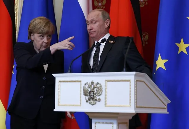 German Chancellor Angela Merkel (L) gestures as Russian President Vladimir Putin looks on during a news conference after talks at the Kremlin in Moscow, Russia, May 10, 2015. Russian President Vladimir Putin said on Sunday that a peace deal agreed in Minsk over the separatist conflict in east Ukraine was moving forward despite problems and that it had been quieter in Ukraine recently. Putin made the comments at a news conference in Moscow with Germany's Angela Merkel. (Photo by Sergei Ilnitsky/Reuters)