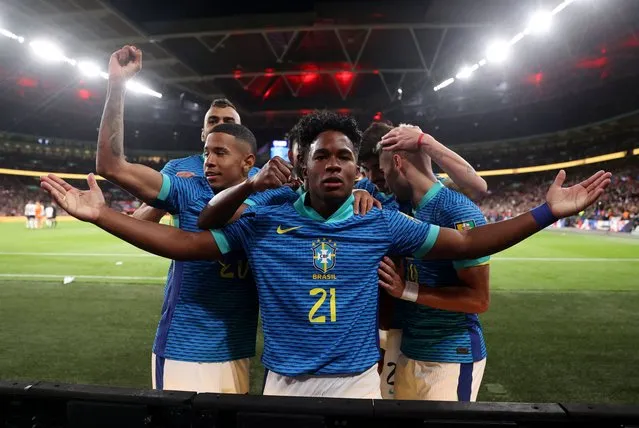 Endrick of Brazil celebrates after scoring his team's first goal with Vinicius Junior of Brazil during the international friendly match between England and Brazil at Wembley Stadium on March 23, 2024 in London, England. (Photo by Carl Recine/Reuters)
