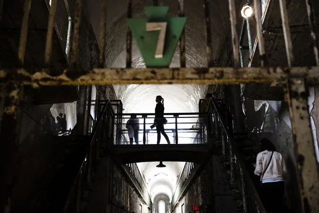 Tourist visit cellblock 7 of the Eastern State Penitentiary, Thursday, May 2, 2019, which is now a museum in Philadelphia. (Photo by Matt Rourke/AP Photo)