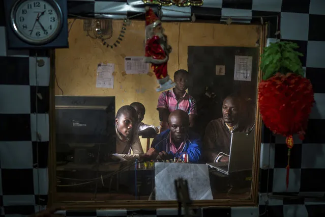 In this Saturday, July 13, 2019 photo, Congolese journalists broadcast an Ebola awareness program from a local radio station in Beni, Congo. Nearly a year of public health messages have failed to reach some Congolese who fear the Ebola vaccine is just another ploy to kill people in a region wracked by violence for a quarter century. (Photo by Jerome Delay/AP Photo)