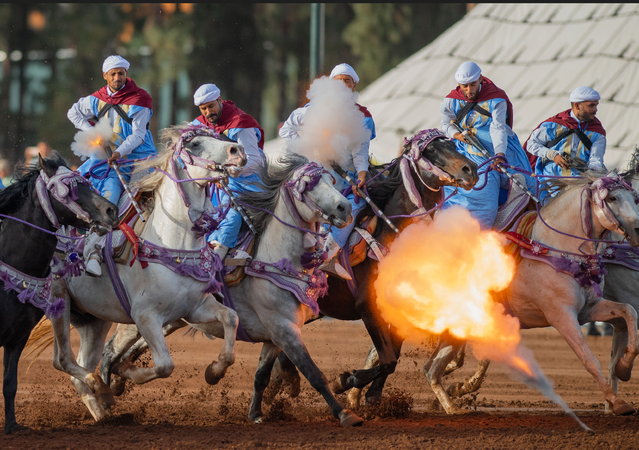 Horse riders perform during the 23rd Hassan II Trophy of Traditional Equestrian Arts (Tbourida) in Rabat, Morocco, 28 May 2024. Tbourida was inscribed in 2021 on UNESCO's representative list of the intangible cultural heritage of humanity. (Photo by Jalal Morchidi/EPA)