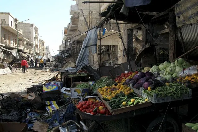 Produce lies amidst damaged shops after an airstrike on a market in the town of Maarat al-Numan in the insurgent stronghold of Idlib province, Syria April 19, 2016. (Photo by Ammar Abdullah/Reuters)