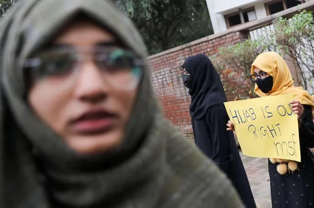 A Muslim student holds a placard during a protest by Muslim Students Federation (MSF) against the recent hijab ban in few of Karnataka's colleges, in New Delhi, India, February 8, 2022. (Photo by Anushree Fadnavis/Reuters)