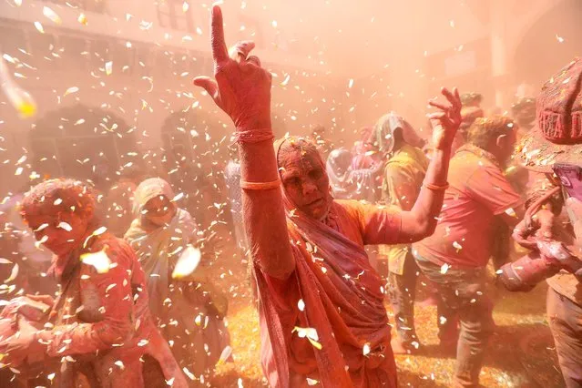 Indian widows participate in the Holi festival in Vrindavan, Uttar Pradesh, India, 15 March 2022. Hundreds of widows from Vrindavan and Varanasi gathered to mark the holi festival after the gap of two years due to the massive Covid-19 spike in cases and  many states including Maharashtra, Delhi, Madhya Pradesh and Uttar Pradesh put restrictions on public gatherings in the past two years. The tradition of Hindu spring festival Holi, also known as festival of Colors marks the beginning of the spring season will be celebrated across the country on 18 March. (Photo by Harish Tyagi/EPA/EFE)