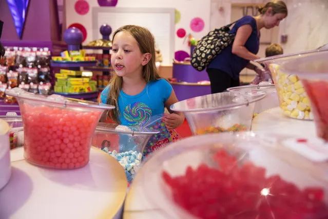 A young girl looks at the array of candy displayed inside FAO Schwarz July 15, 2015. (Photo by Lucas Jackson/Reuters)