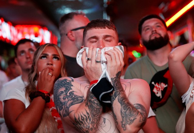 British football fans react to Spain's second goal that sealed their victory in the Euro Cup final on July 14, 2024 in Benidorm, Spain. Pubs and bars across Benidorm, the resort town known as a magnet for British tourists and expats, screened tonight's EUFA EURO 2024 final between England and Spain, which took place in Berlin. (Photo by Eva Manez/Reuters)