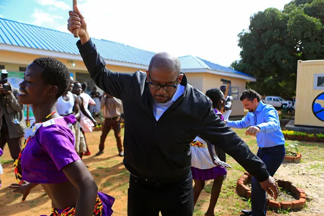 U.S. actor Forest Whitaker participates in the Acholi tribe's traditional dance during his visit to expand the Youth Peacemaker Network in Acholi sub region, in Gulu town, northern Uganda May 2, 2017. (Photo by James Akena/Reuters)