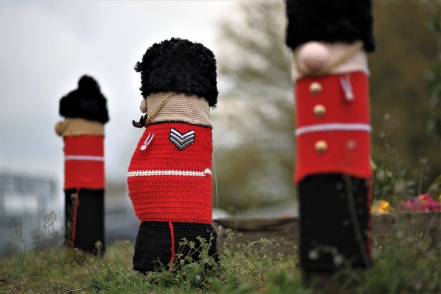 A view of knitted Grenadier Guards figures made by members of the 'Hurst Hookers' knitting group after their fitting to posts during a pre-coronation 'yarn bombing' in the village of Hurst, near Reading, England, Friday, April 21, 2023. Heather Howarth and her friends in the village of Hurst, a stone’s throw from Reading, west of London, have fashioned a woolly coronation procession to rival the pomp and circumstance that will take place when Charles is crowned on May 6 at Westminster Abbey. (Photo by David Cliff/AP Photo)