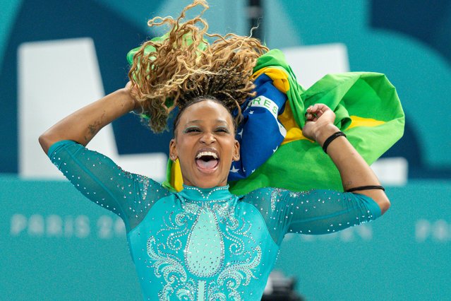 Gold medal winner Rebeca Andrade of Brazil celebrates with the brazilian flag while women´s floor exercise final on day ten of the Olympic Games Paris 2024 at Bercy Arena on August 05, 2024 in Paris, France. (Photo by Rodolfo Buhrer/Eurasia Sport Images/Getty Images)