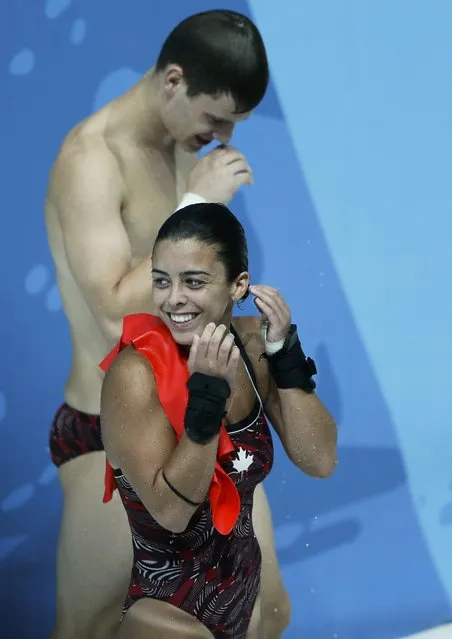 Canada's second placed Meaghan Benfeito and Vincent Riendeau react after the mixed 10m synchro platform final at the Aquatics World Championships in Kazan, Russia, July 25, 2015. (Photo by Stefan Wermuth/Reuters)