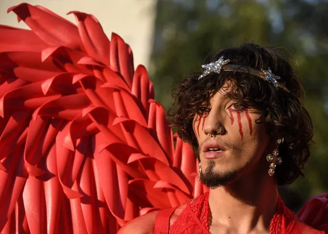 A participant in costume is seen during the Pride Parade in Bucharest on August 14, 2021. Thousands of members and supporters of the LGBT community took part in the march in downtown Bucharest to celebrate the diversity. (Photo by Daniel Mihailescu/AFP Photo)