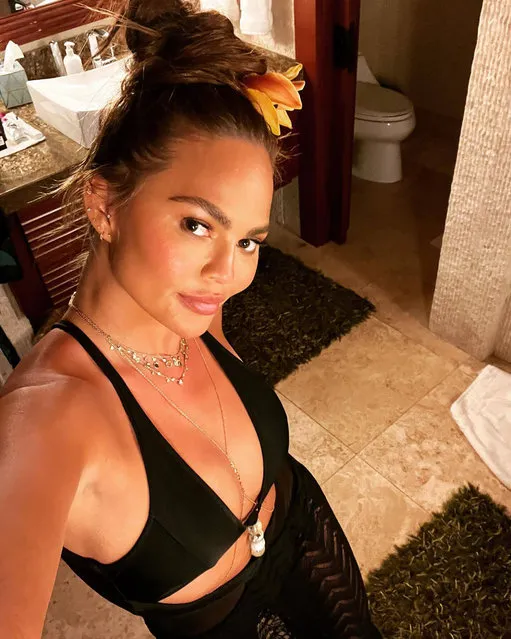 American model and television personality Chrissy Teigen poses next to a toiletin the first decade of April 2022. She swears she doesn't “pee and poop into”. (Photo by chrissyteigen/Instagram)