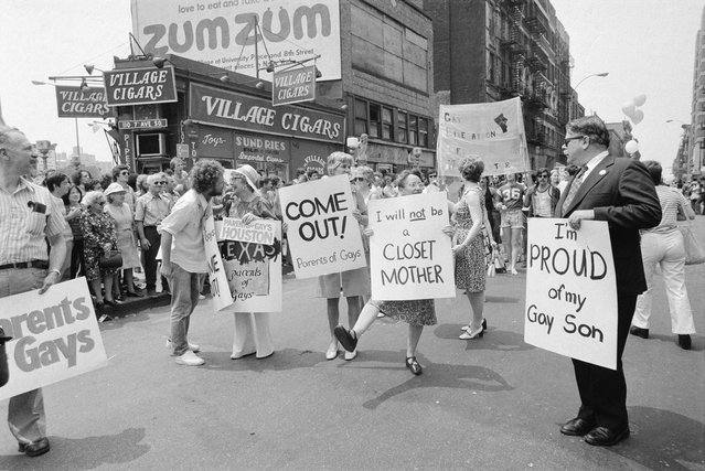 Parents march in support of LGBTQ rights at Gay Pride parade in Greenwich Village, New York City, US, 30th June 1974; (right) is American lawyer Dick Ashworth marching with a sign that reads “I'm Proud of My Gay Son”. He later became one of the founding members of PFLAG (Parents, Families, and Friends of Lesbians and Gays). (Photo by Bettmann via Getty Images)