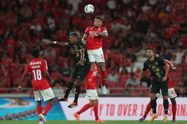 Estrela da Amadora's Portuguese forward #25 Nilton Varela Lopes (2L) and Benfica's Argentine defender #30 Nicolas Otamendi vie for a header during the Portuguese League football match between SL Benfica and CF Estrela da Amadora at the Luz stadium in Lisbon, on August 24, 2024. (Photo by Carlos Costa/AFP Photo)