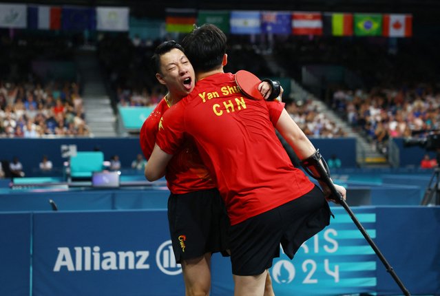 Keli Liao and Shuo Yan anof China celebrate after winning Para Table Tennis Men's Doubles - MD14 - Gold Medal Match Game 11 on day four of the Paris 2024 Summer Paralympic Games at South Paris Arena on September 01, 2024 in Paris, France. (Photo by Kacper Pempel/Reuters)